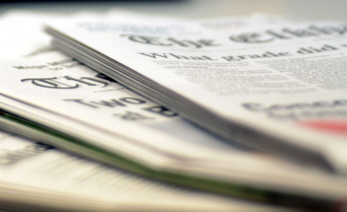 Opinion-Newspaper-stack-detail-shot