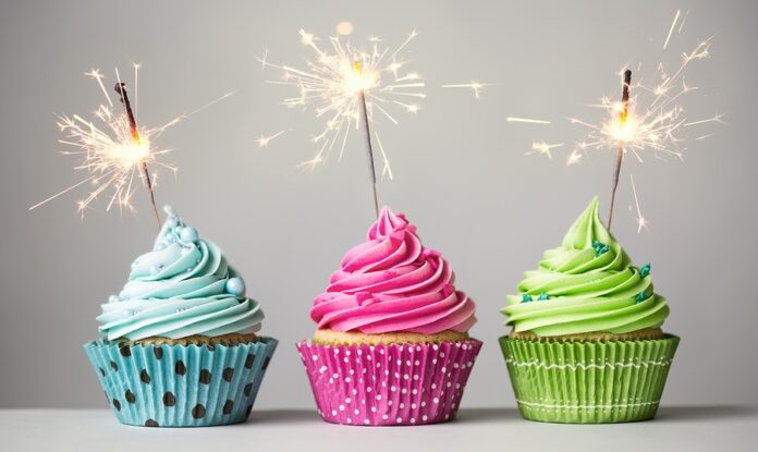 Row of three cupcakes with sparklers
